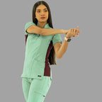 Filipina médica 930 verde menta y vino, vista frontal estirando los brazos.