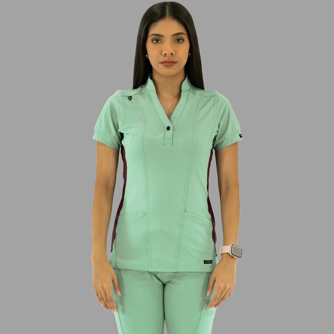Vista frontal de la filipina y pantalón médico verde menta con detalles vino.