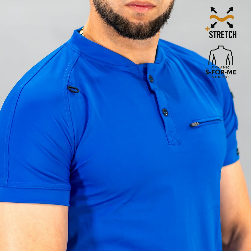 Detalle de manga raglán y bolsillo de filipina azul rey hombre Scrubs 901